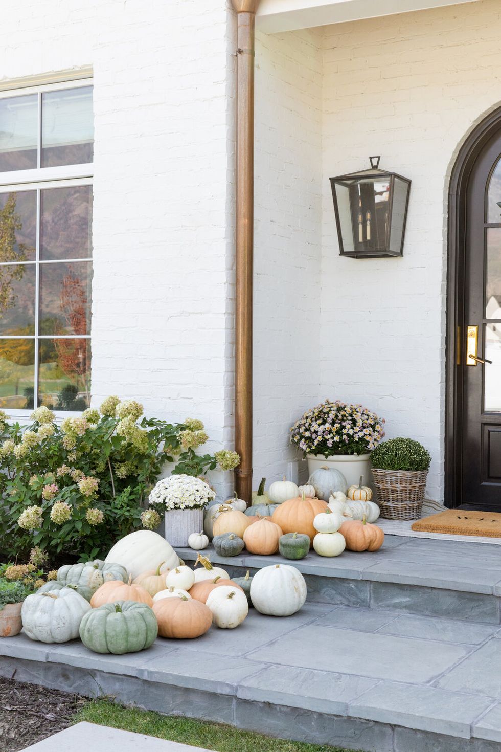 fall front porch with heirloom pumpkins from studio mcgee