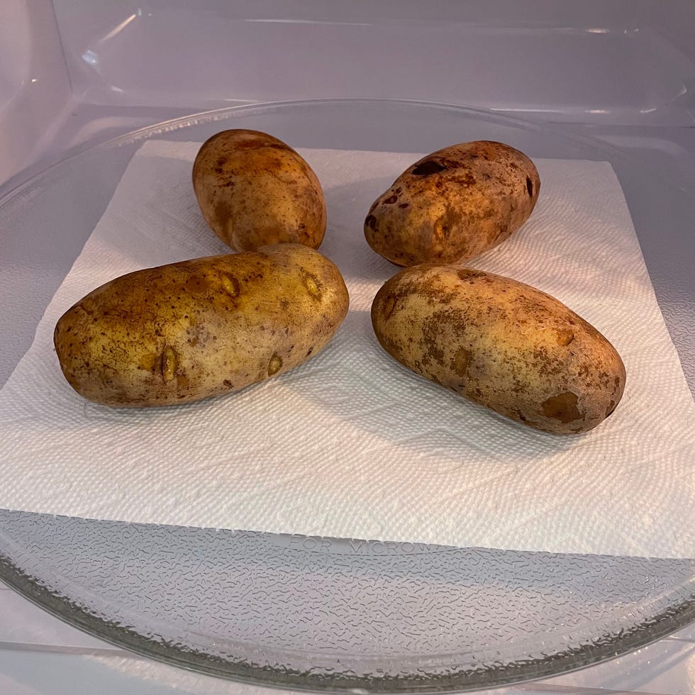Microwave testing potatoes are "baked" in the microwave