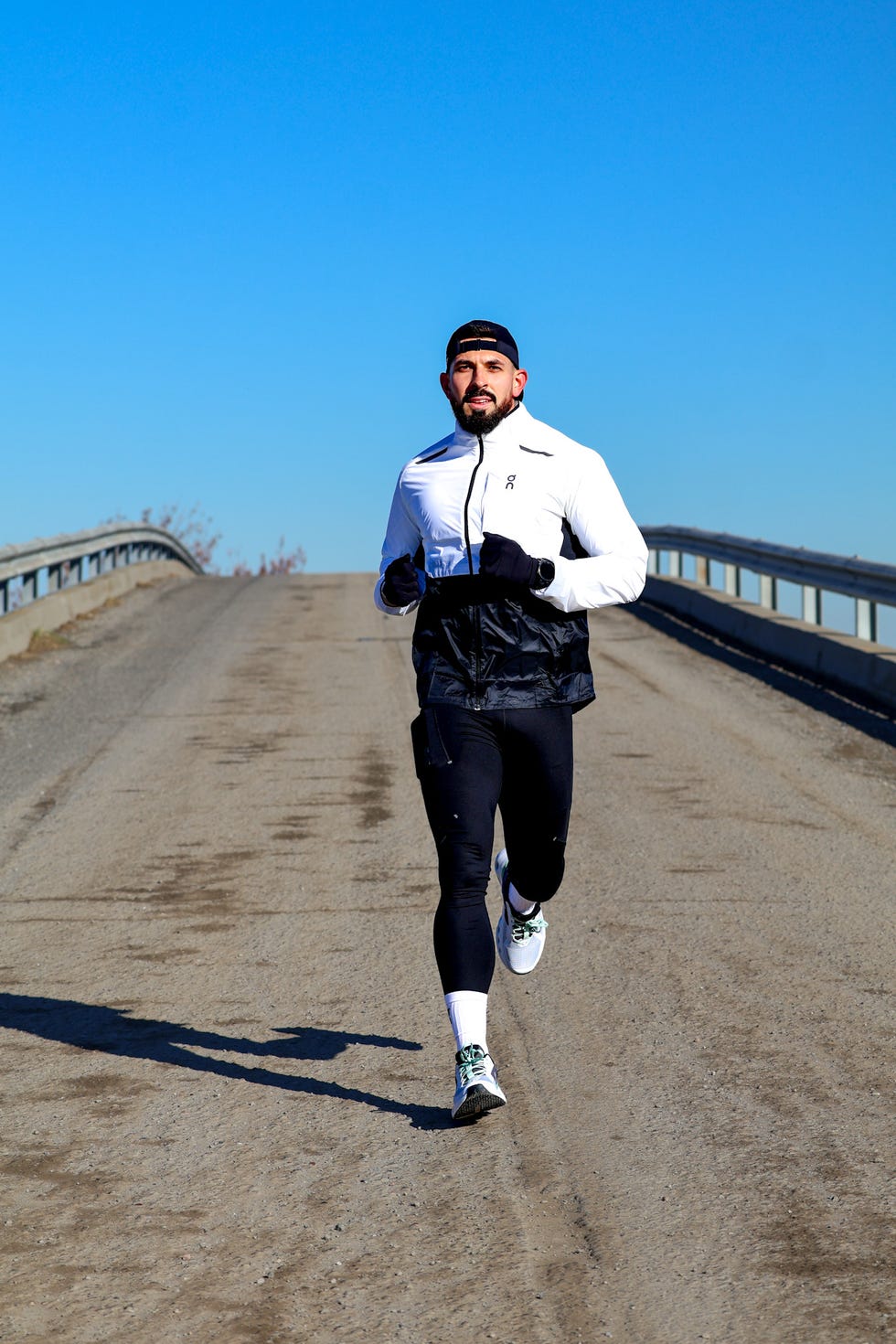 man running on a dirt road