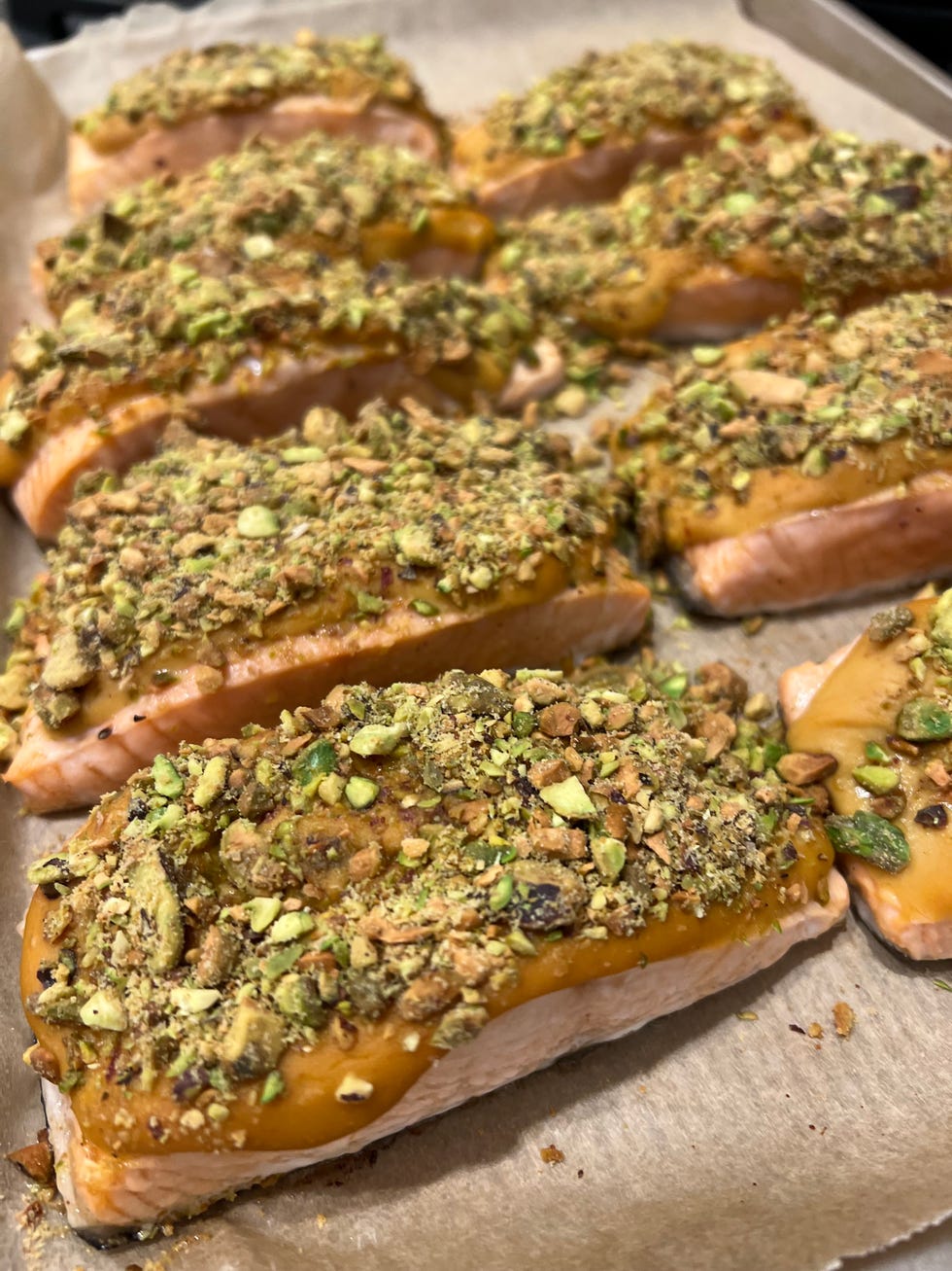 baked salmon topped with pistachios for best seafood delivery services