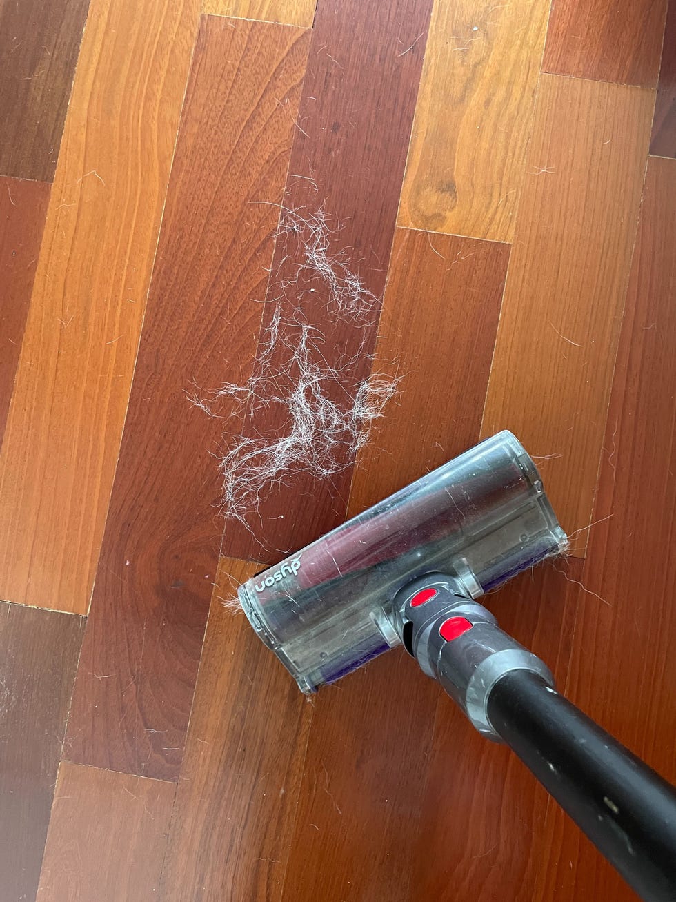 a black and silver fire extinguisher on a wooden surface