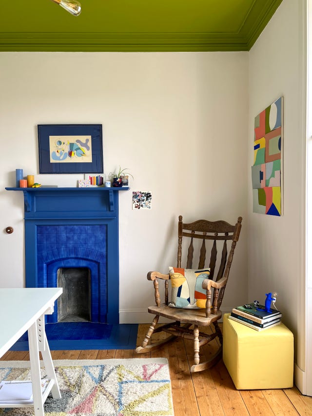 colorful office space with blue fireplace