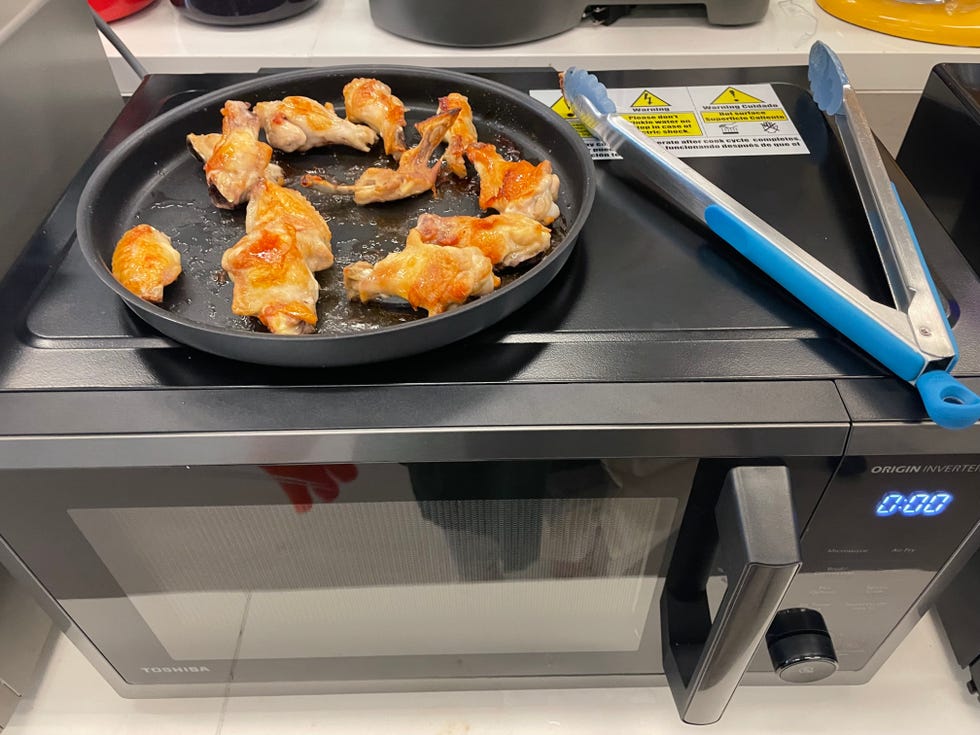 air fried chicken wings on top of microwave toaster oven combo