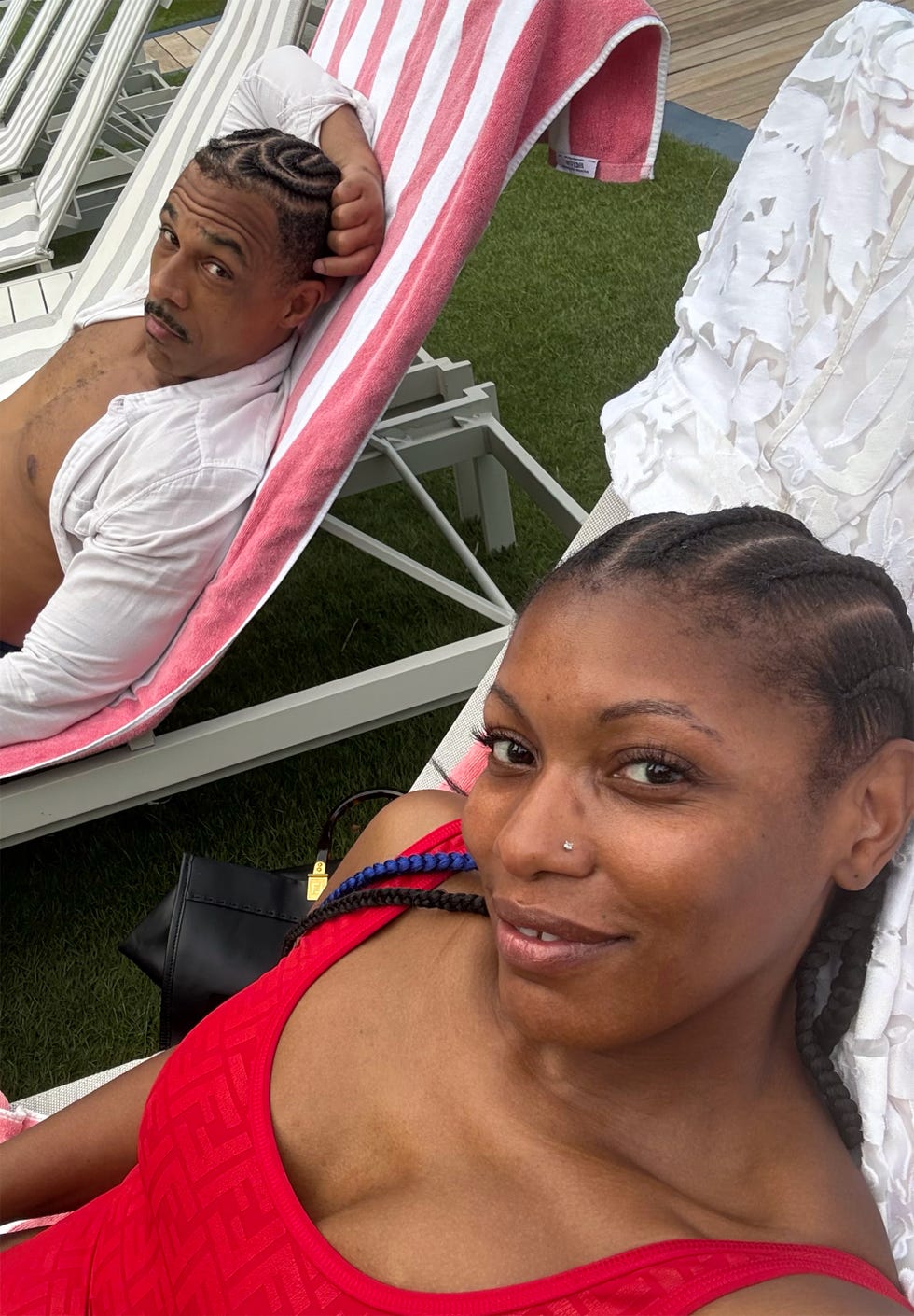 the author and her husband lounging at the pool
