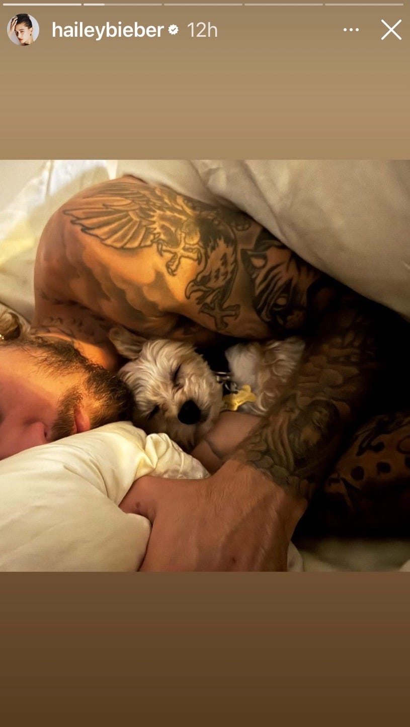 a man sleeping with a dog