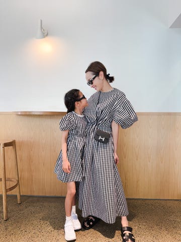 two women in dresses