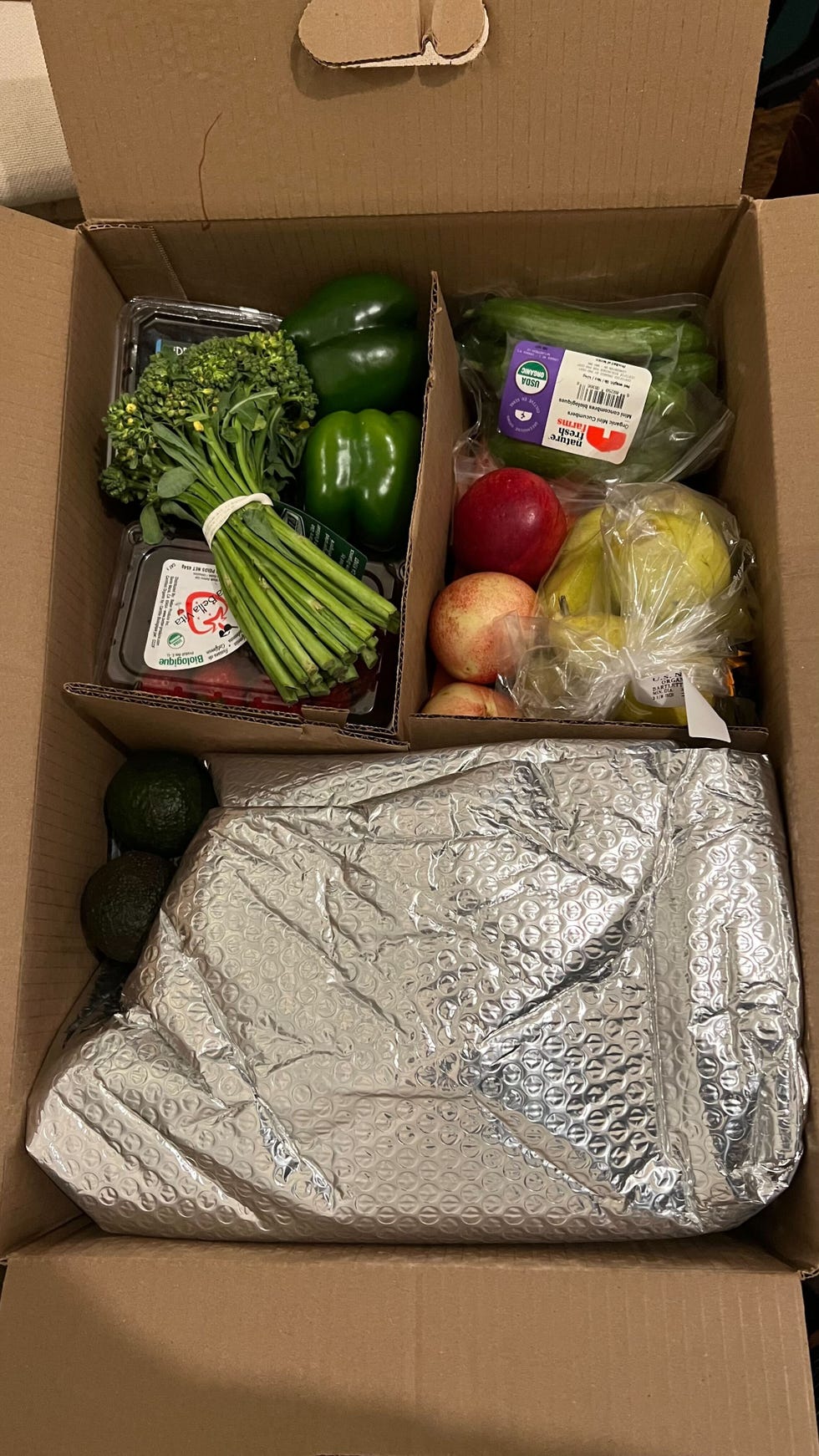 unboxing a box of vegetables from imperfect foods