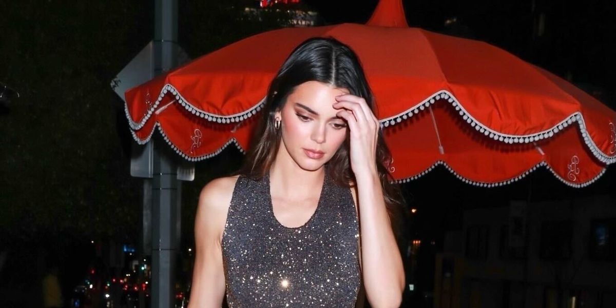 Kendall Jenner catches the eye in a gold chain dress as she heads on girls'  night out in New York