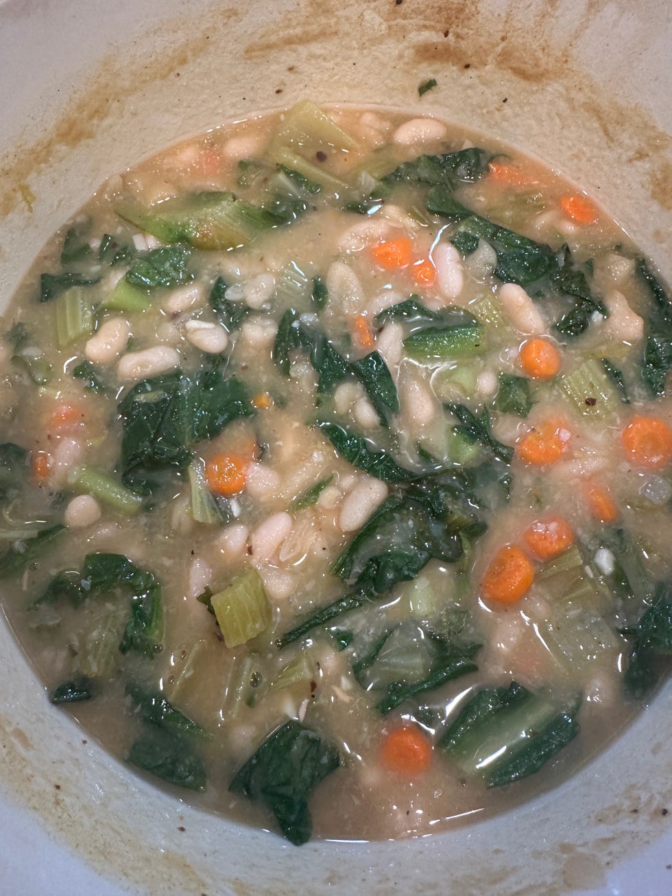 white bean and escarole soup inside of le creuset dutch oven