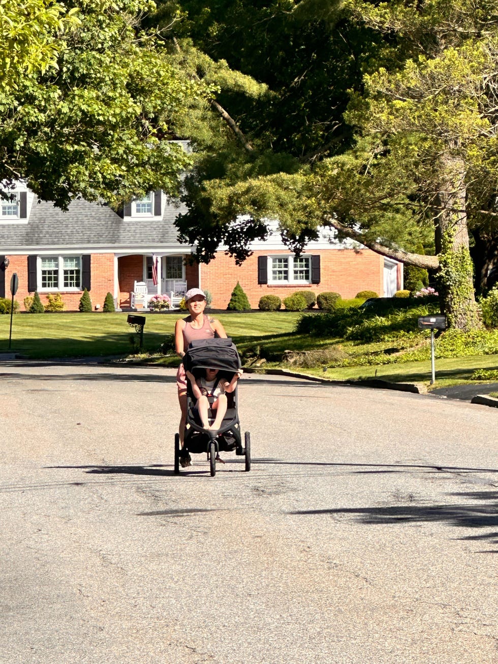 a person pushing a stroller