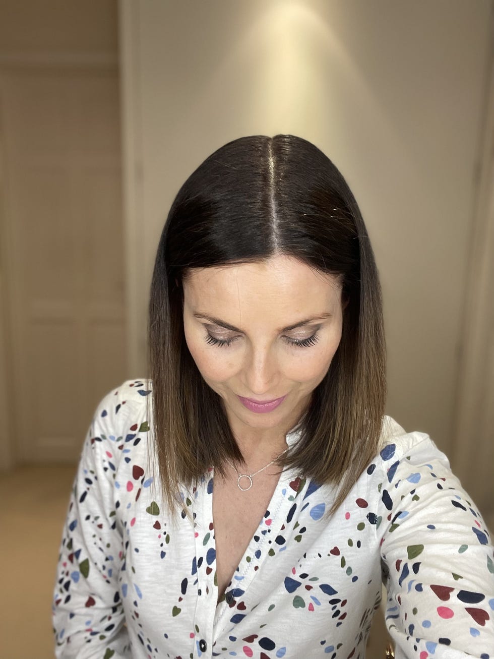 a woman with her eyes closed