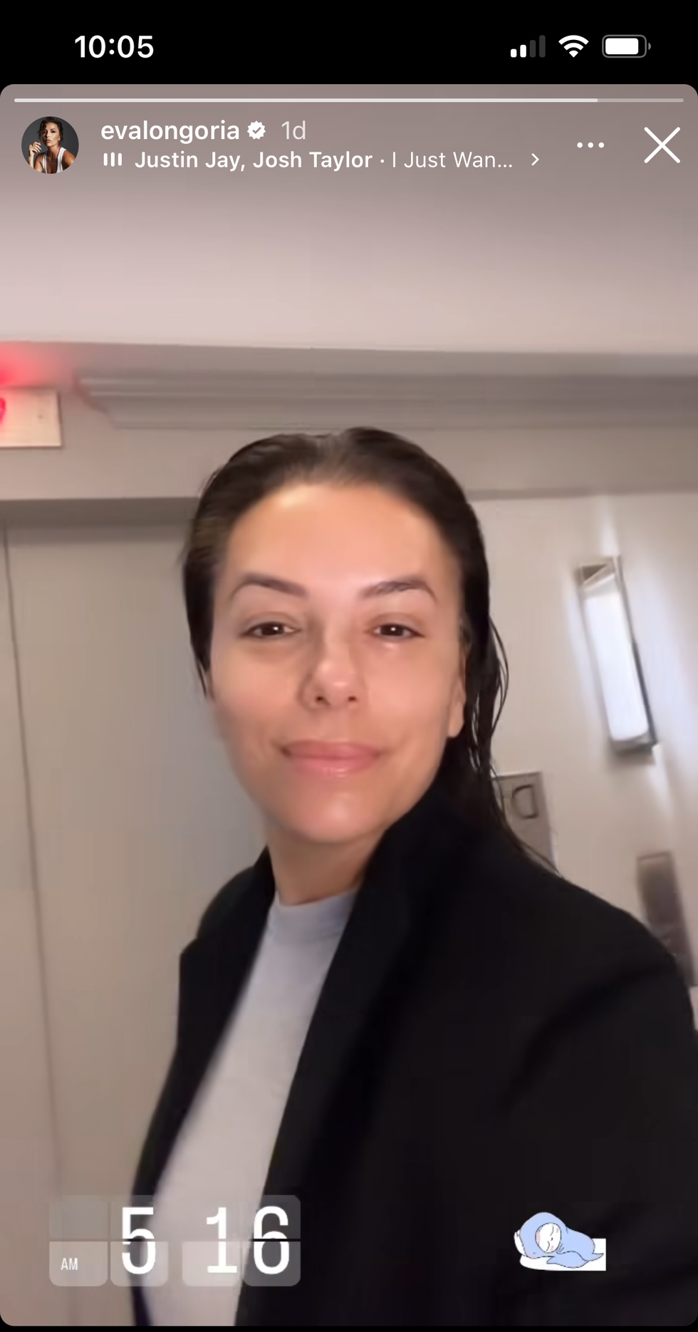 eva longoria taking a selfie in a hotel coridor with no makeup
