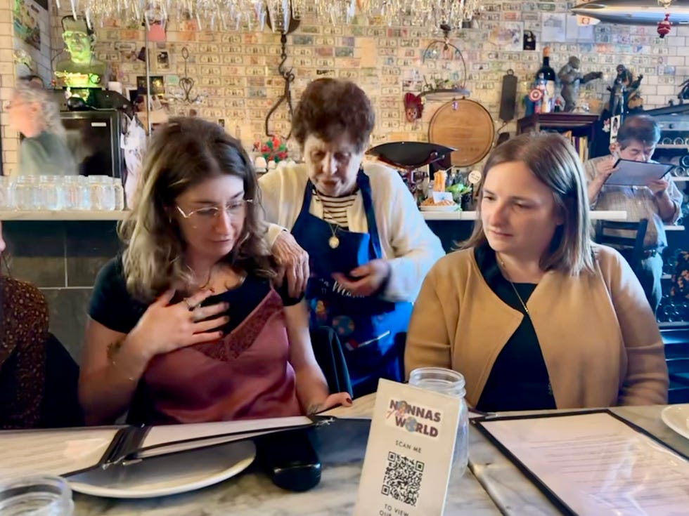 dining scene at a restaurant with guests and staff interacting