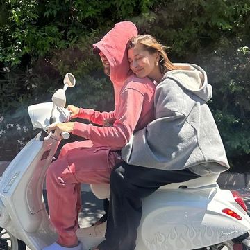 a man and woman on a motorcycle