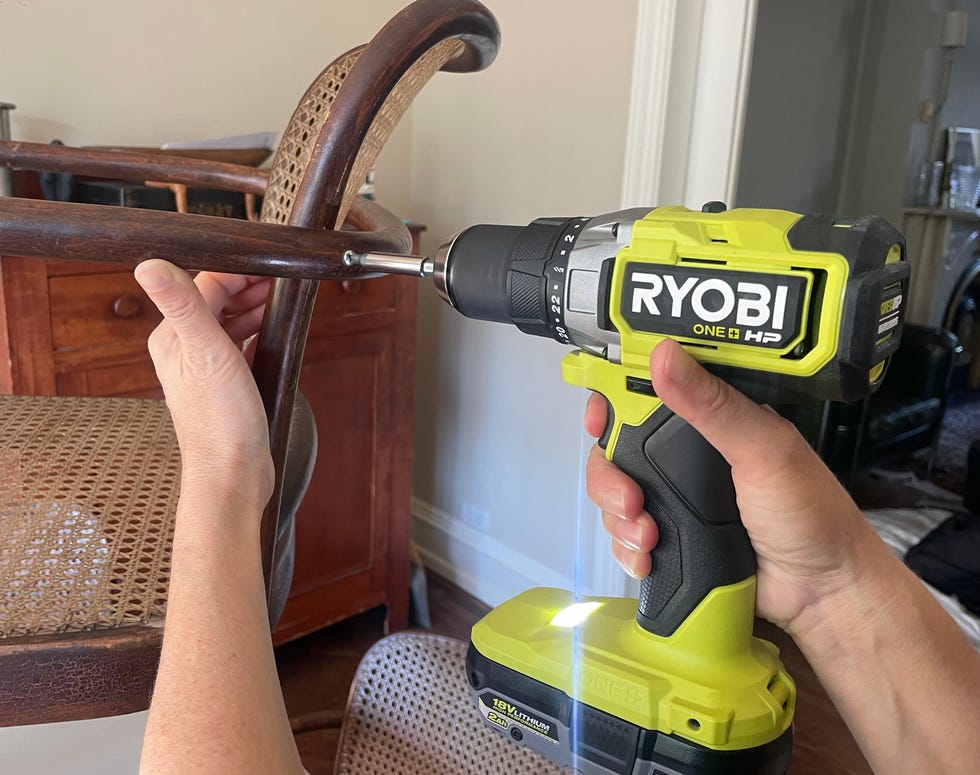 a cordless drill from ridgid is used to assemble furniture