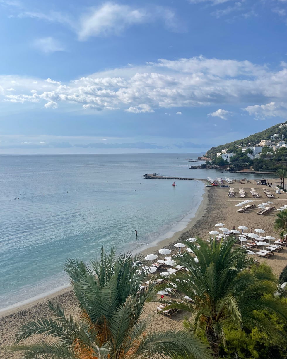 a view a beach with many people on it
