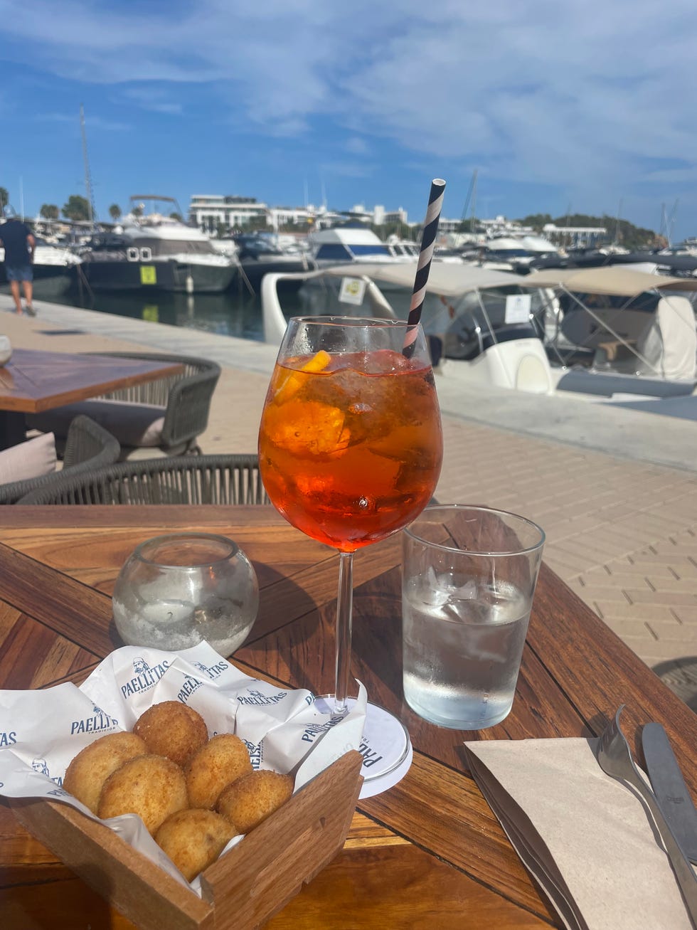 an aperol spritz and croquettas