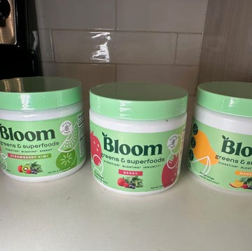 three containers of bloom greens and superfoods in various flavors three containers of bloom greens and superfoods in various flavors