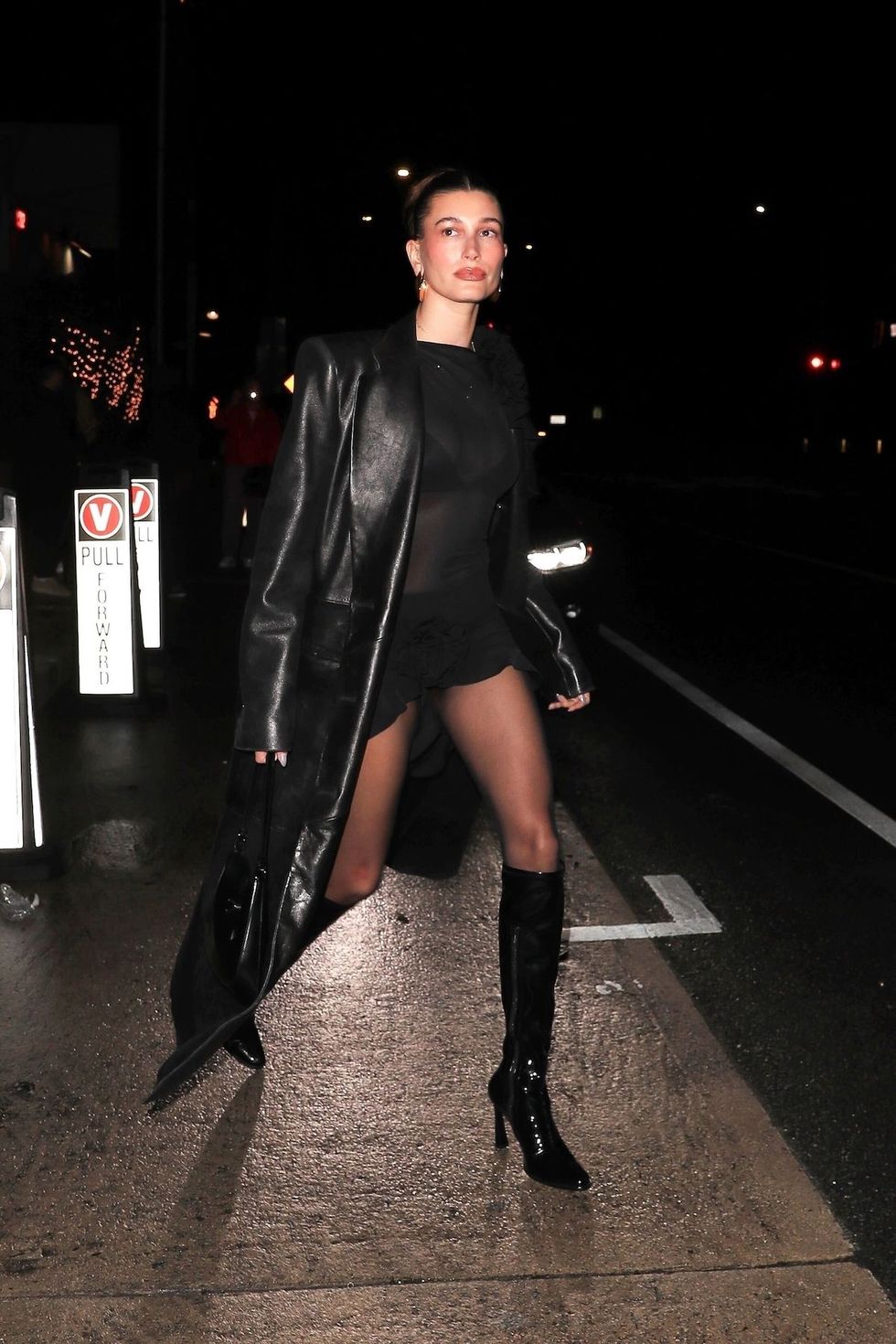 Hailey Bieber rocks a cut out mini dress and sheer stockings
