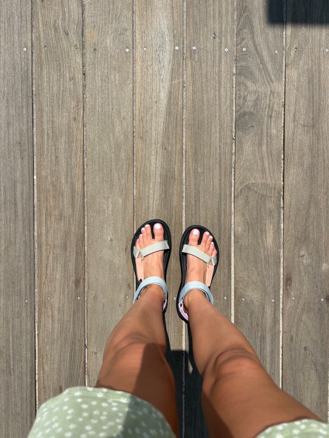 cavallo wearing the ﻿teva hurricane xlt2 sandal while walking on a boardwalk