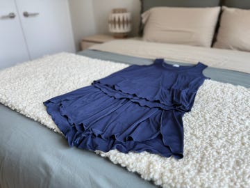 navy blue clothing set on a bed