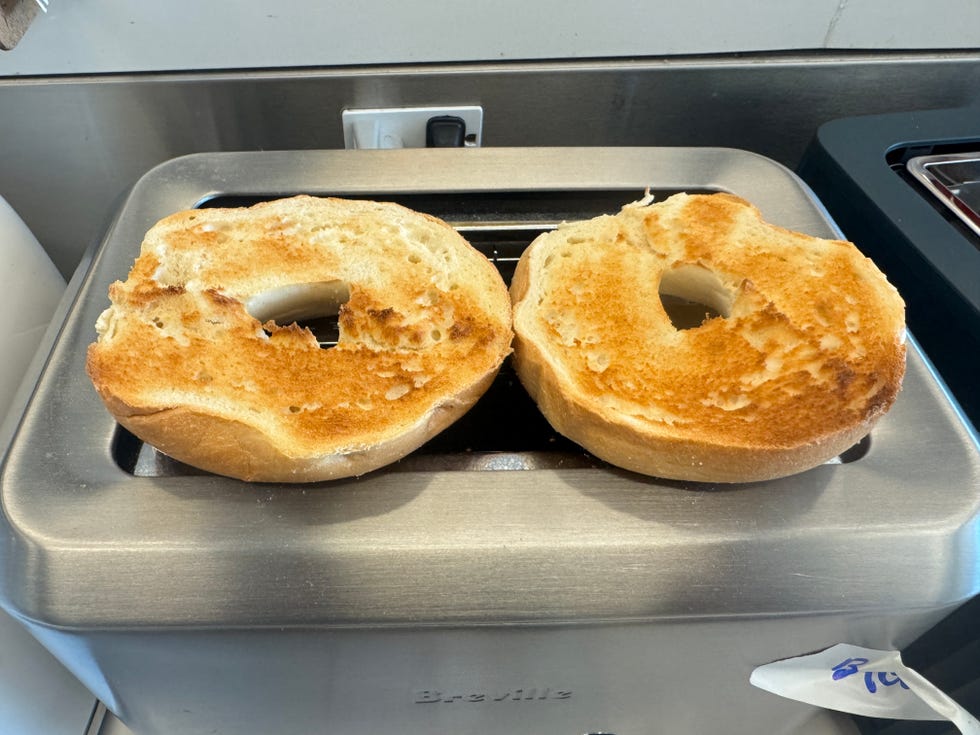 a toasted bagel on top of a toaster