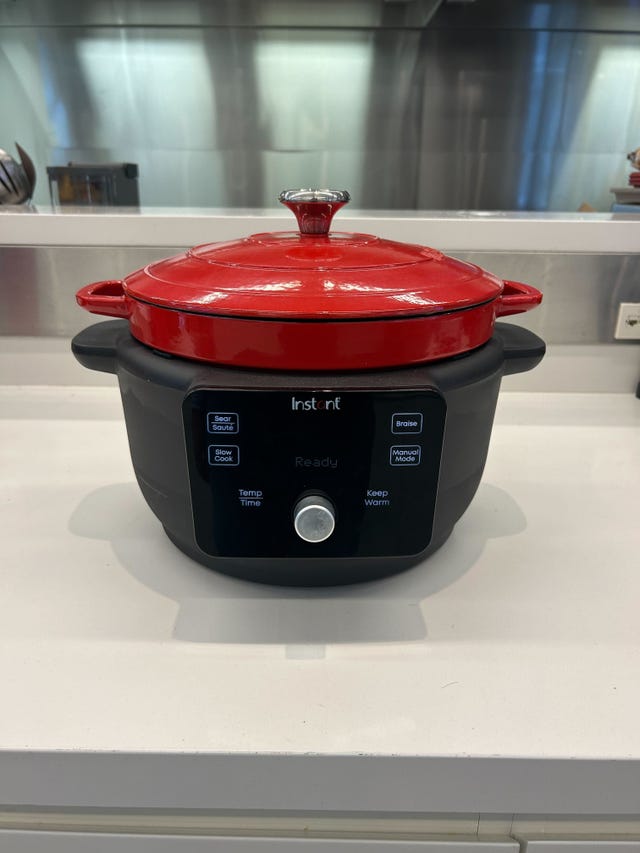 multifunctional electric cooking pot with a red lid