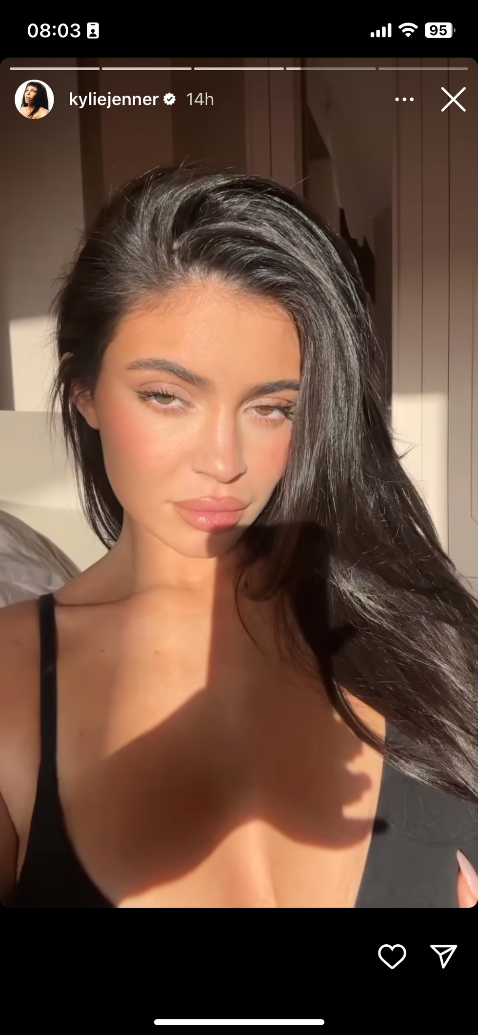 Kylie Jenner spills out of plunging black bra in racy pic, but Kardashian  fans say Kim's trying to 'steal her spotlight