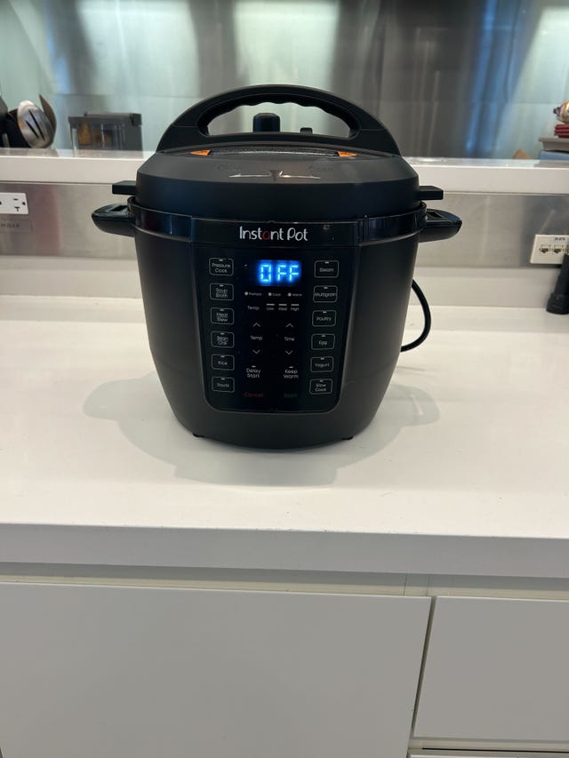 electric pressure cooker on a kitchen countertop