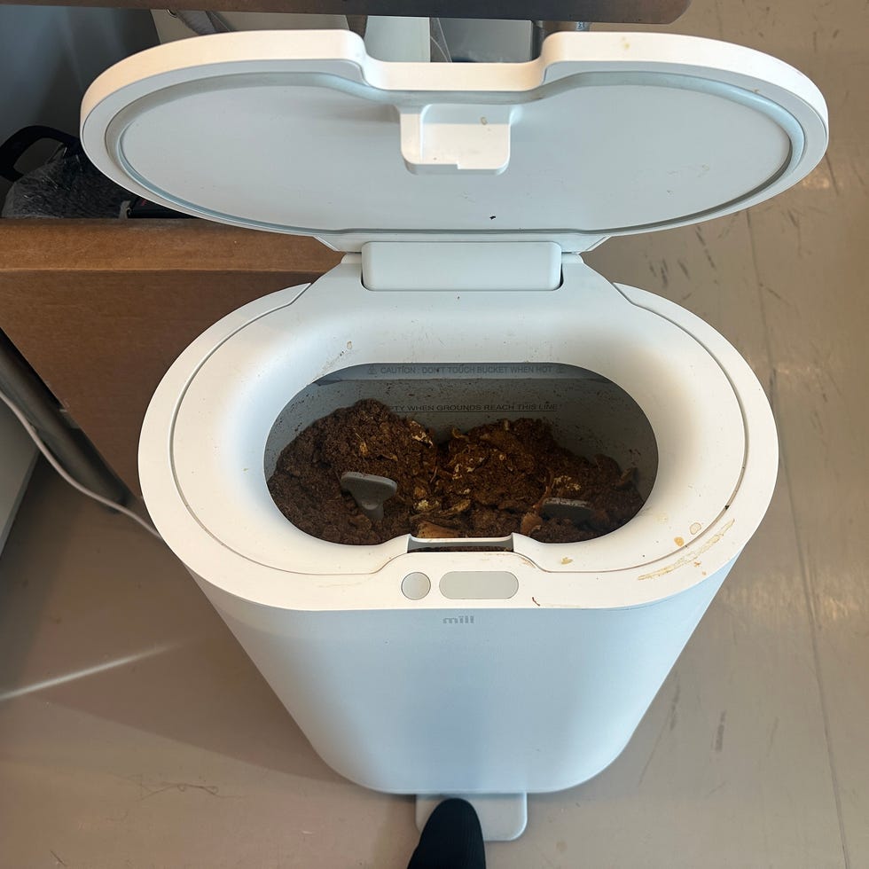 composter testing kitchen compost with waste inside