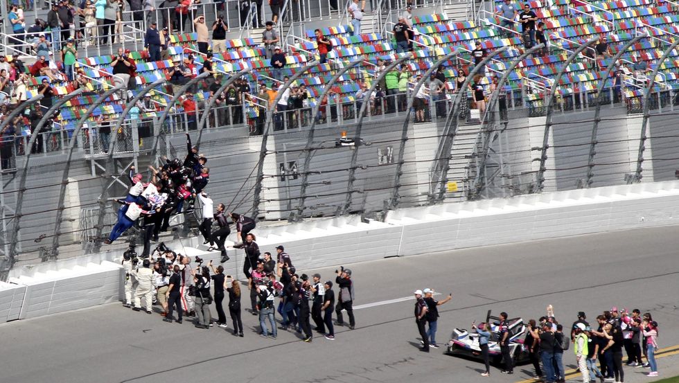 the no 60 acura team celebrates their victory