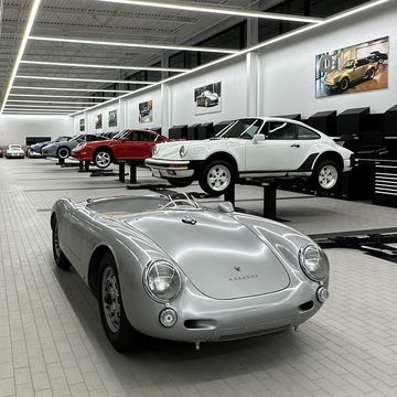 porsche classic factory restoration facility featuring a 550 spyder and a number of 911s