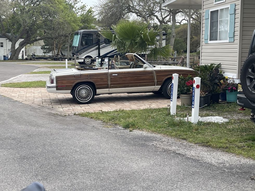 woody lebaron parked outside a mobile home