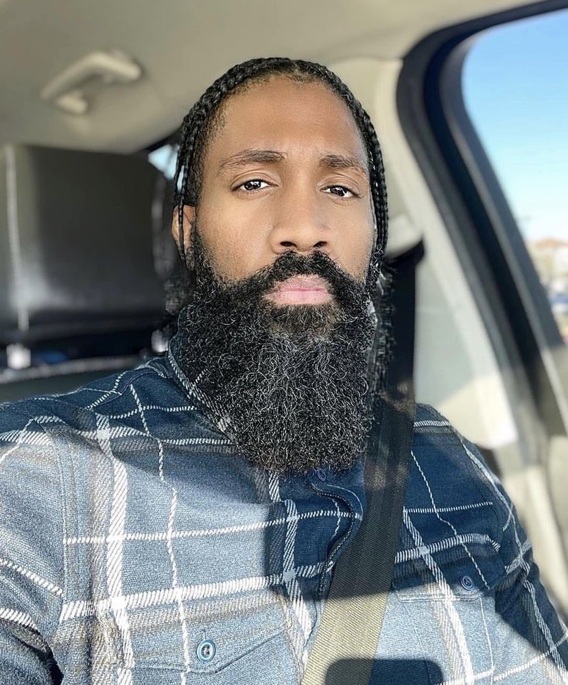 a man with a beard in a car