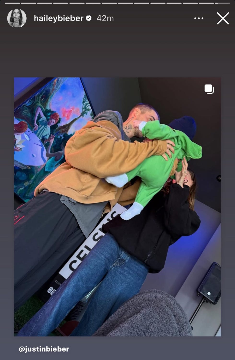 a couple interacting with a child in a cozy indoor setting