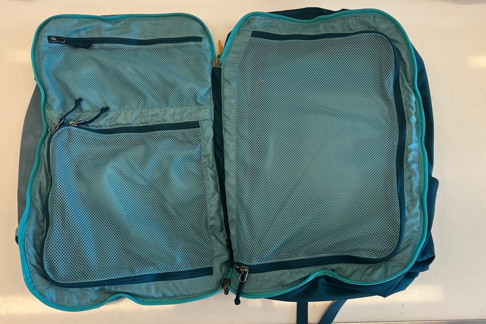 best carry on backpacks - cotopaxi allpa 42l pack an open cotopaxi allpa 42l pack on a white table, good housekeeping's testing for the best carry on backpacks