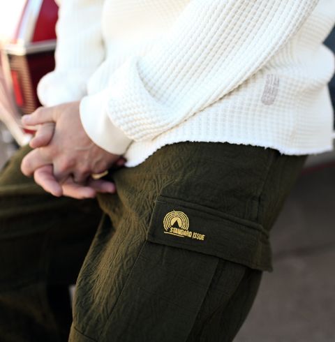 a closer look at the co branded embroidery on the left cargo pocket flap
