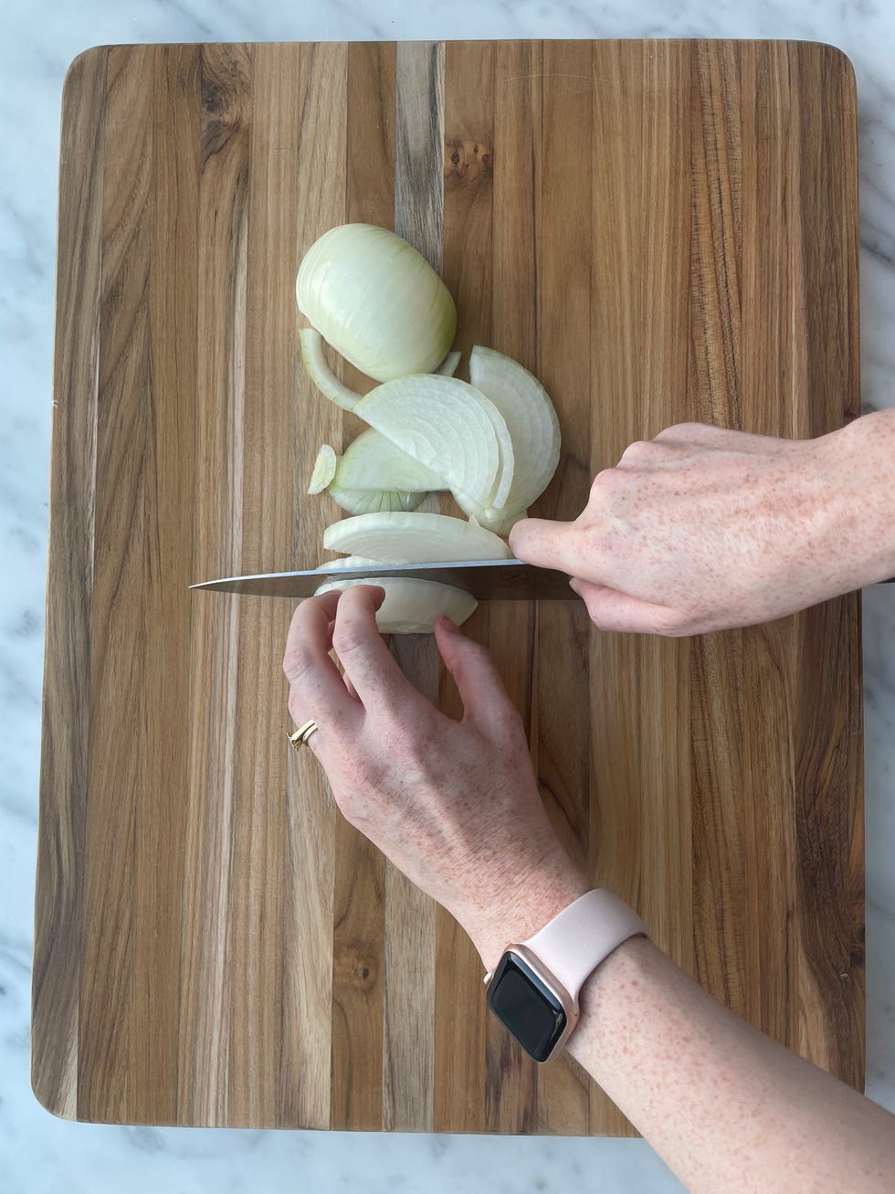 chopping onion on a cutting board