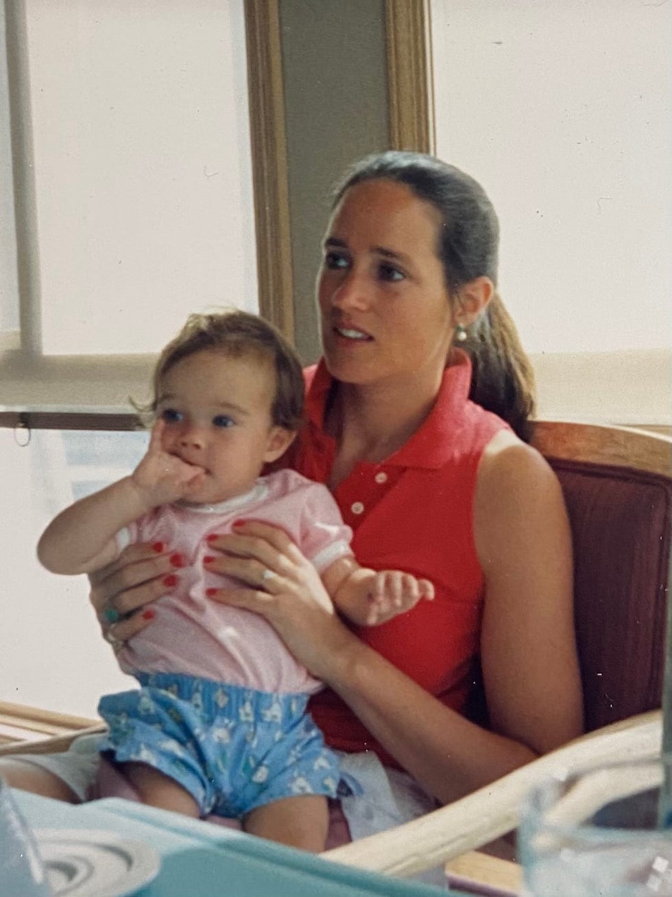 a woman holding a baby