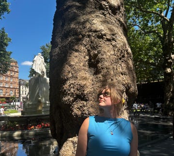 sofia looking at trees in leicester sq