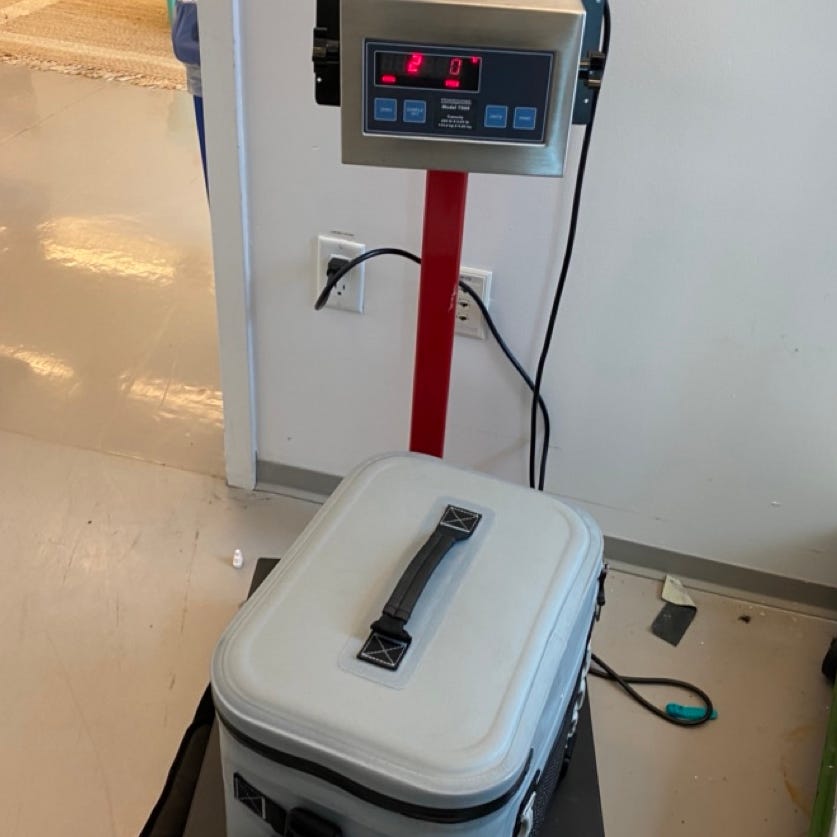 a cooler being weighed during testing