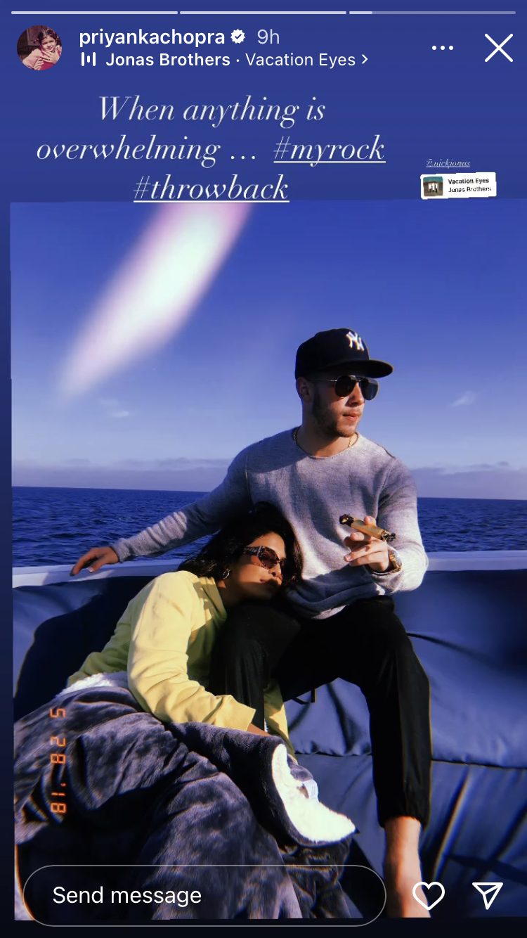 priyanka and nick sitting on a boat