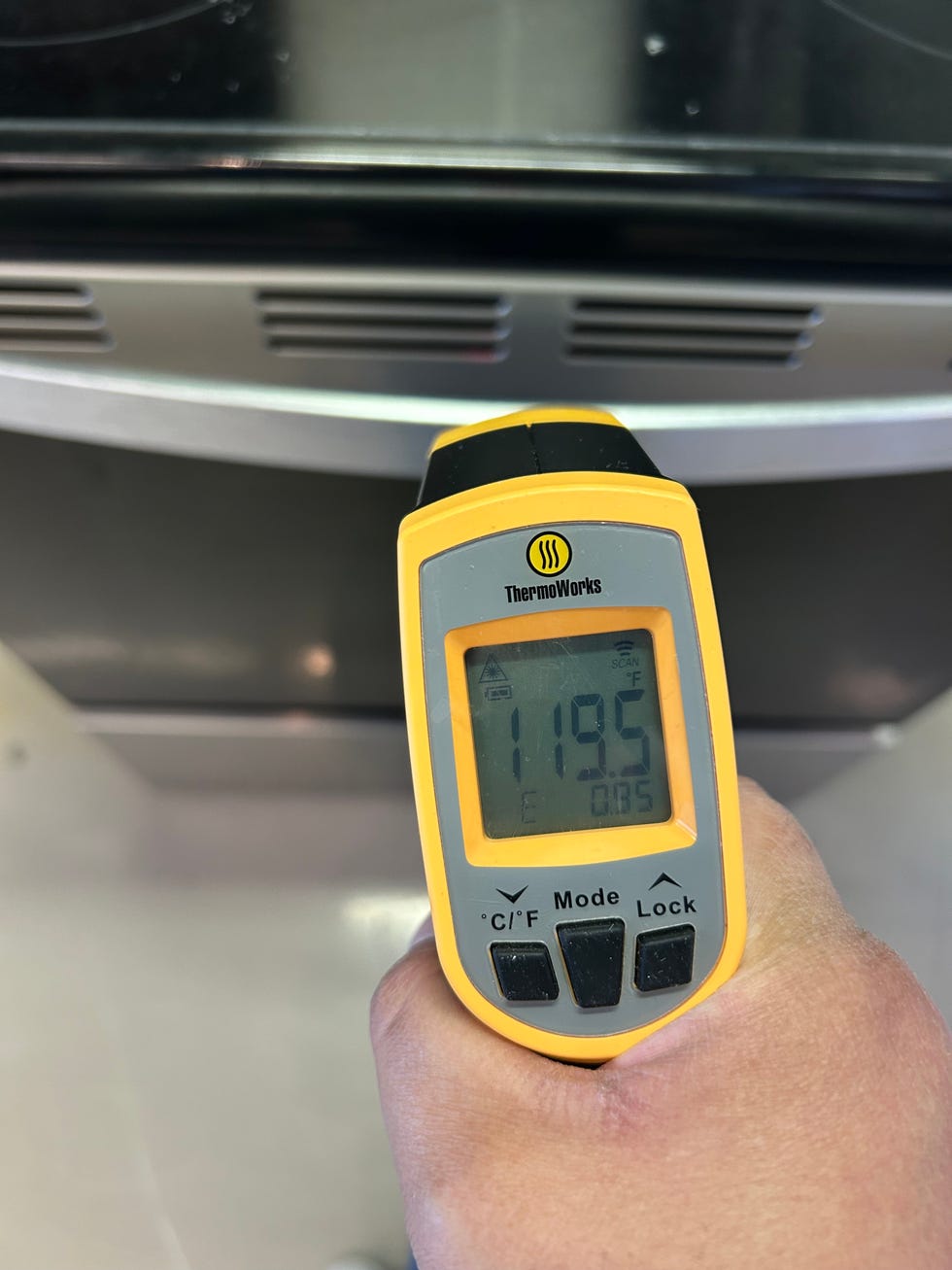 thermoworks temperature gauge measuring the controls on a range during lab testing