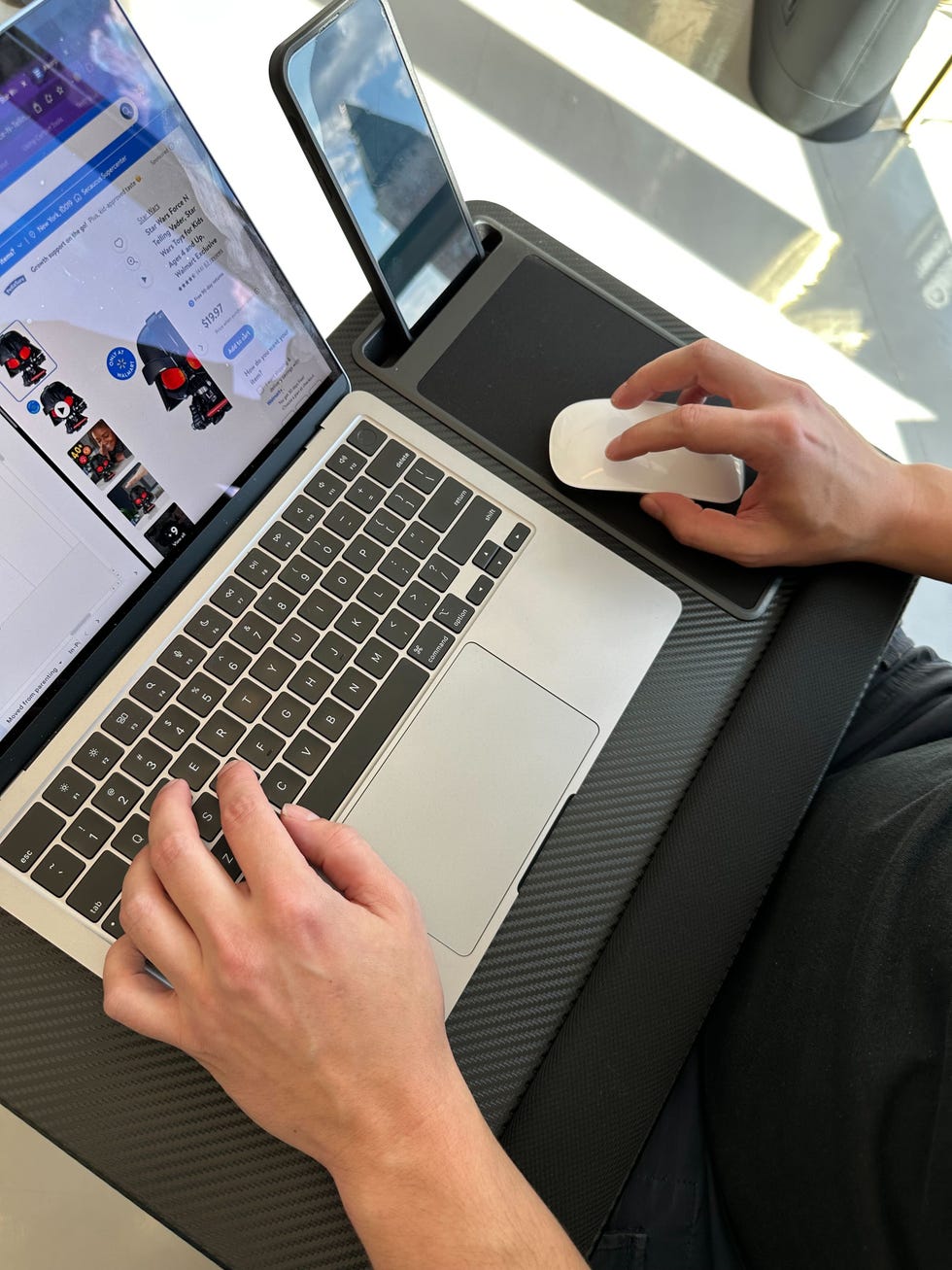 test engineer testing the lap gear lap desk using a laptop, phone and the mouse
