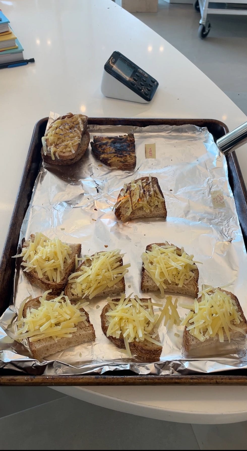 using a kitchen torch to melt cheese on toast