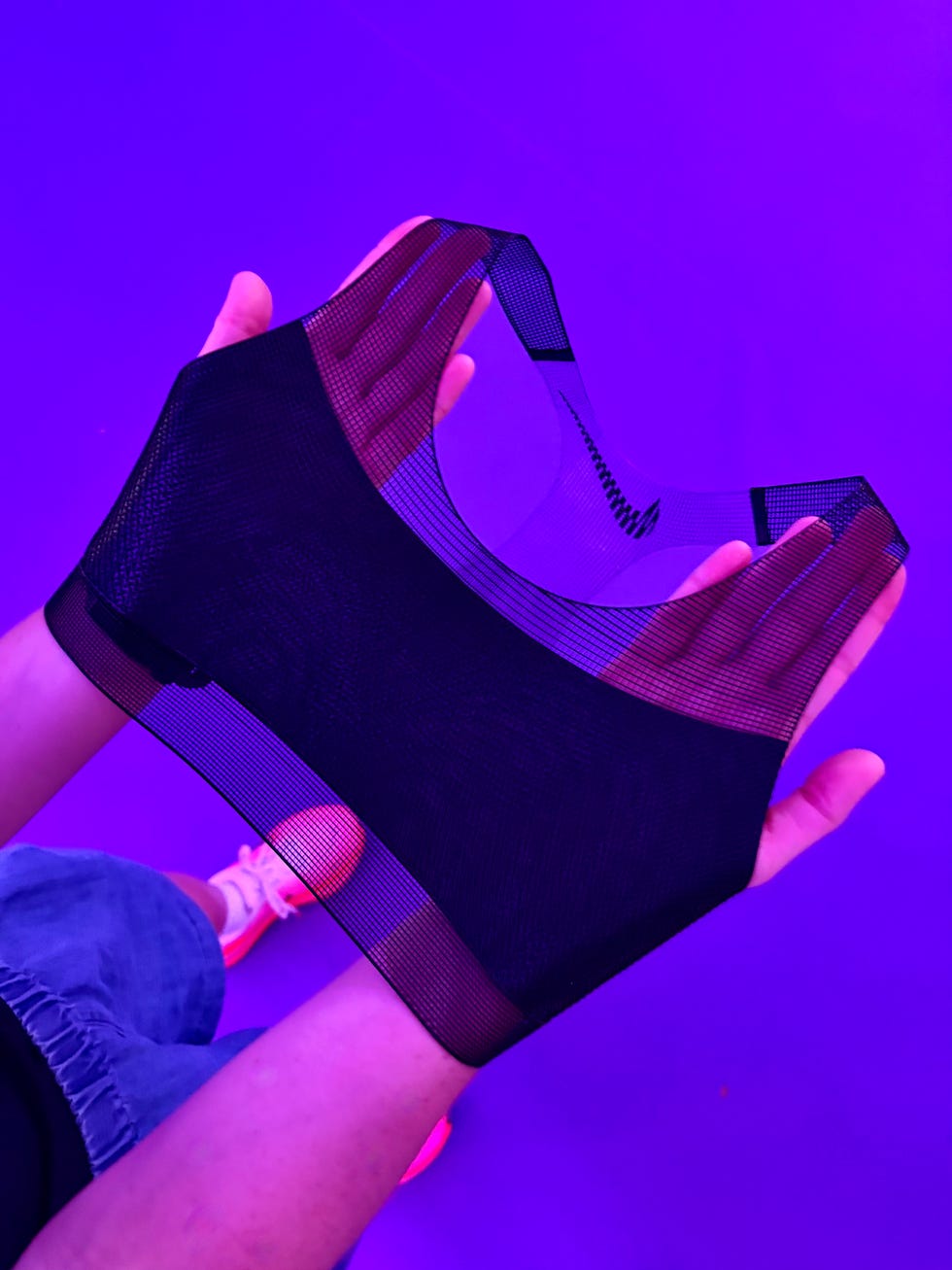 a high tech sports bra being held up