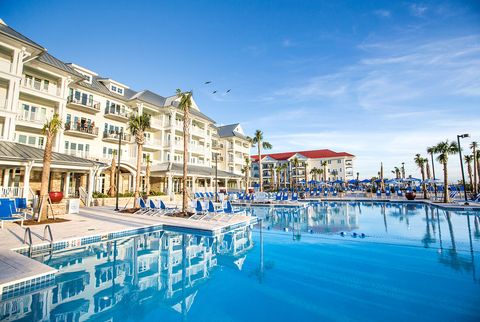 Resort, Town, Swimming pool, Building, Property, Vacation, Resort town, Sky, Azure, Real estate, 