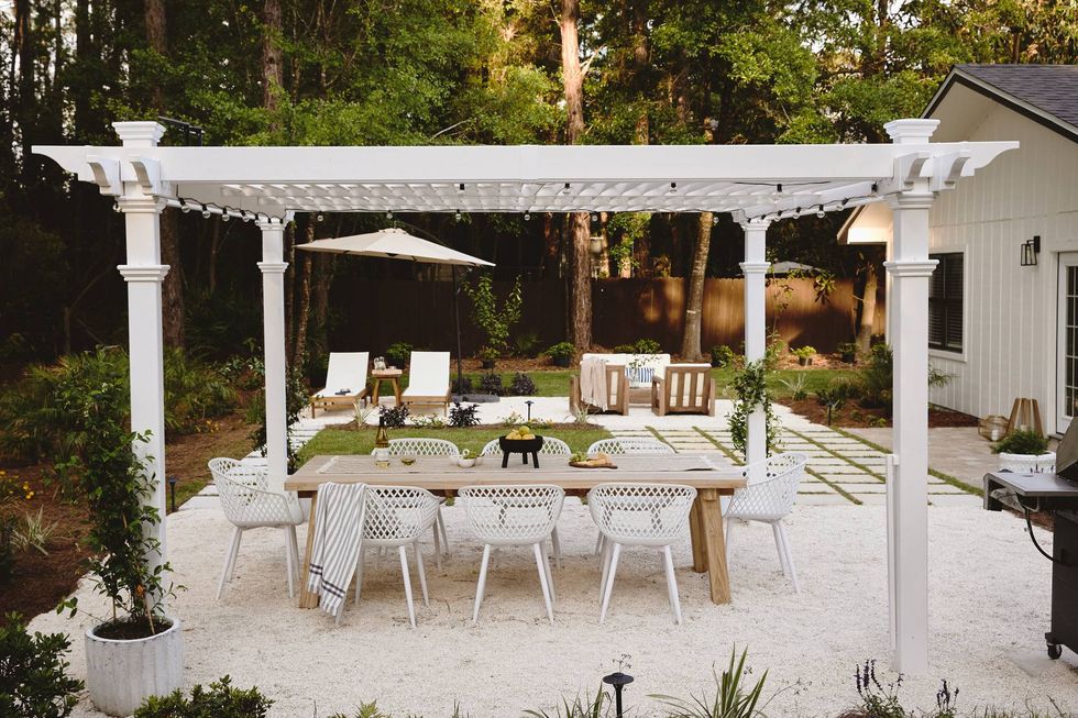 pergola ideas white with lights over wood dining table
