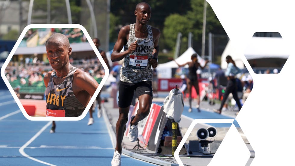 a couple of men running on a track with a crowd watching