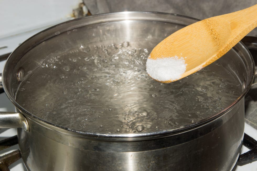 In boiling water pour salt with a wooden spoon.